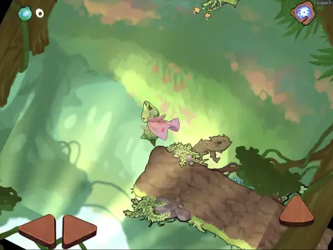 Boo leaping over a mossy rock in the green canopy